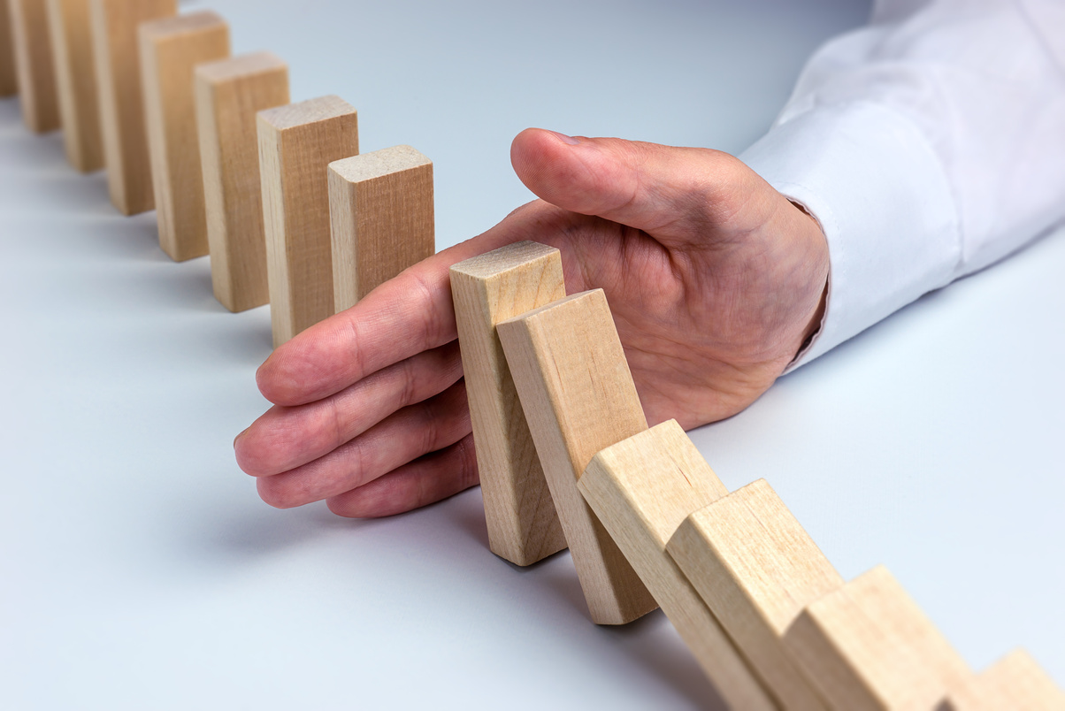Stop Domino Effect - Hand Prevents Failure
